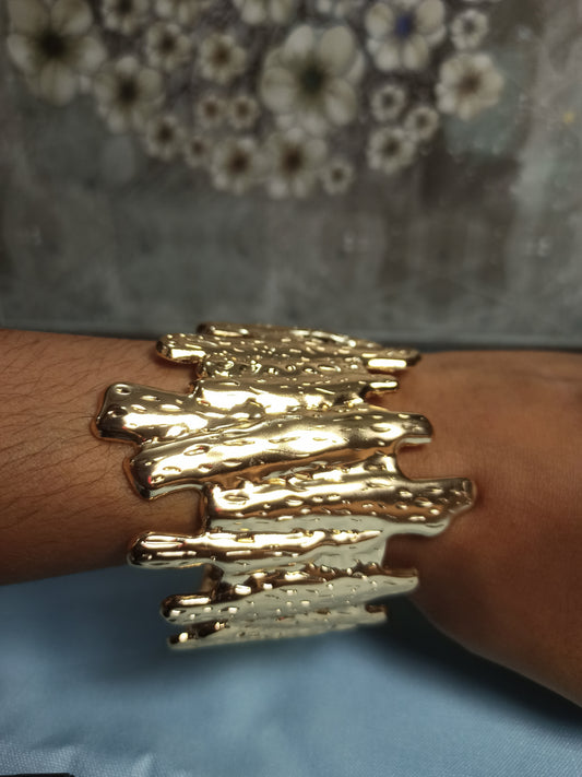 Textured golden cuff bracelet